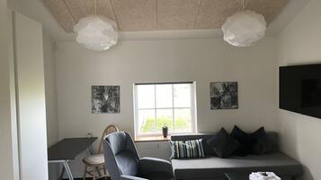 Premium Quadruple Room | Desk, laptop workspace, iron/ironing board, travel crib