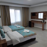 Family Triple Room | Minibar, in-room safe, free WiFi, bed sheets