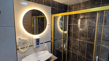 Shower, free toiletries, hair dryer, slippers