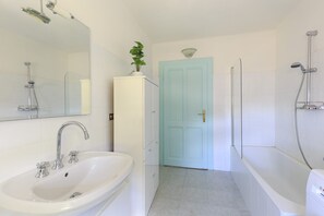 Combined shower/tub, hair dryer, towels, toilet paper