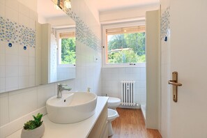 Combined shower/tub, hair dryer, towels, toilet paper
