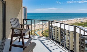 A balcony with a view of a beach and ocean. - 9400 Building - Oceanfront Condo with Panoramic views of the ocean and bay! (Ocean City)