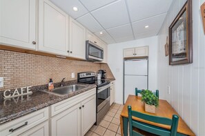 Fridge, microwave, stovetop, cookware/dishes/utensils
