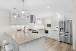 Fridge, dishwasher, dining tables