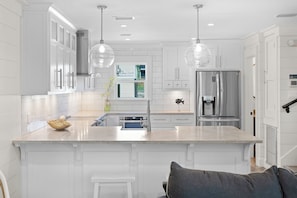 Fridge, dishwasher, dining tables