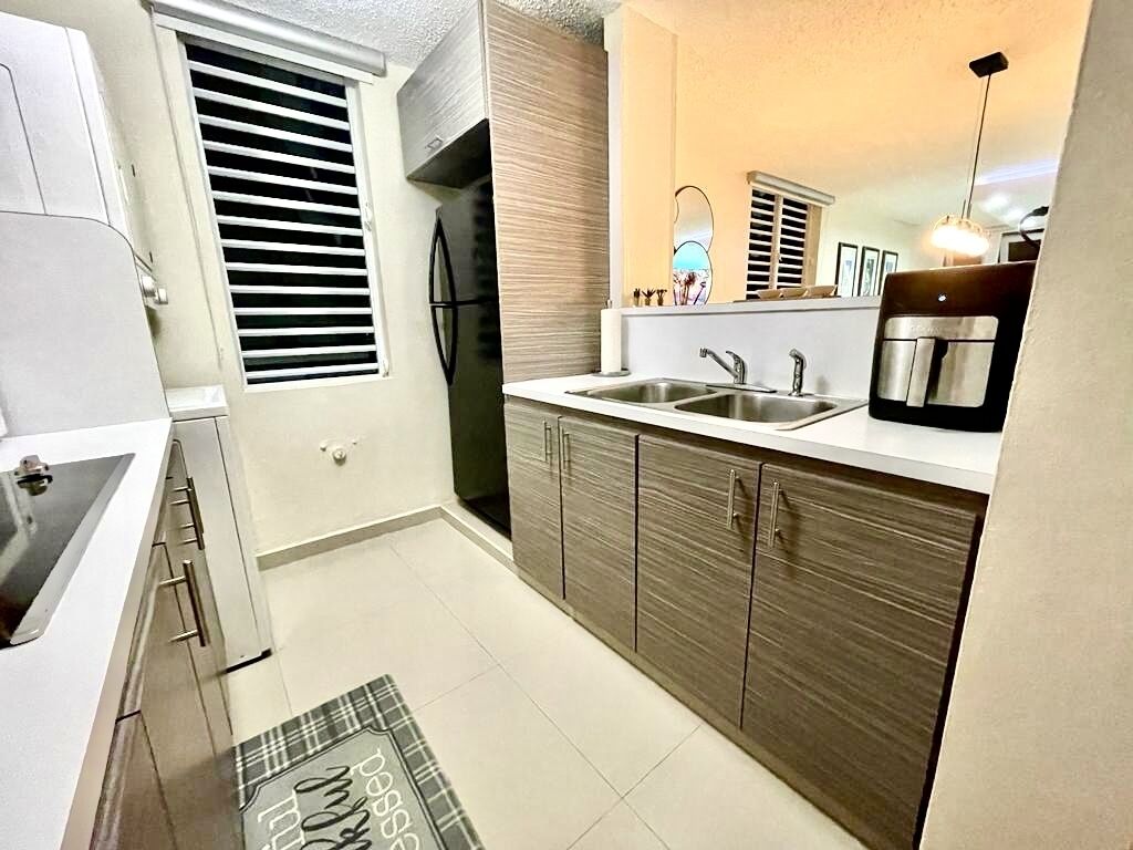 Fridge, microwave, stovetop, coffee/tea maker