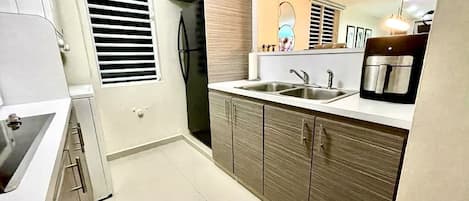 Fridge, microwave, stovetop, coffee/tea maker
