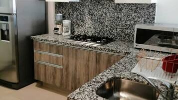 Fridge, microwave, stovetop, coffee/tea maker