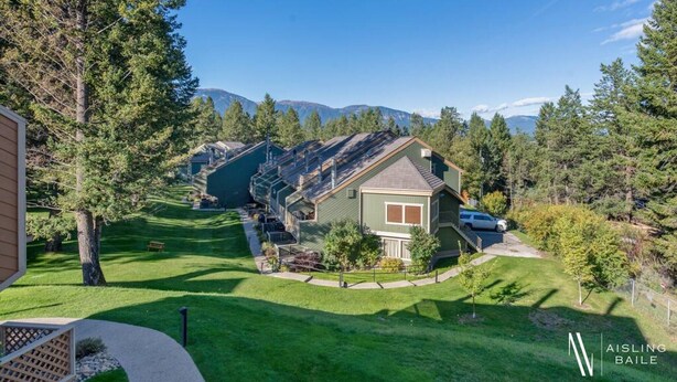 A residential area with a house featuring a sloped roof, a front yard, and a driveway. - Fresh Air Feelings | Indoor Pool & Hot Tub | Beach (Windermere)