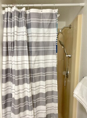 Combined shower/tub, hair dryer, towels, soap