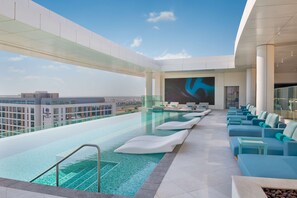 2 outdoor pools, open 8:00 AM to 11:00 PM, pool umbrellas, pool loungers - The WB Abu Dhabi, Curio Collection by Hilton (Abu Dhabi)
