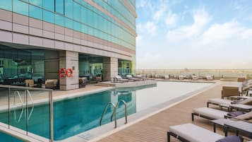 Outdoor pool, open 7:00 AM to 6:00 PM, pool umbrellas, pool loungers