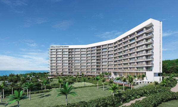 Il s'agit d'un hôtel à plusieurs étages doté d'une façade incurvée, appelé « Hilton Grand Vacations ». Chaque étage dispose de balcons, et l'établissement comprend également un espace piscine et de beaux jardins paysagers agrémentés de palmiers.