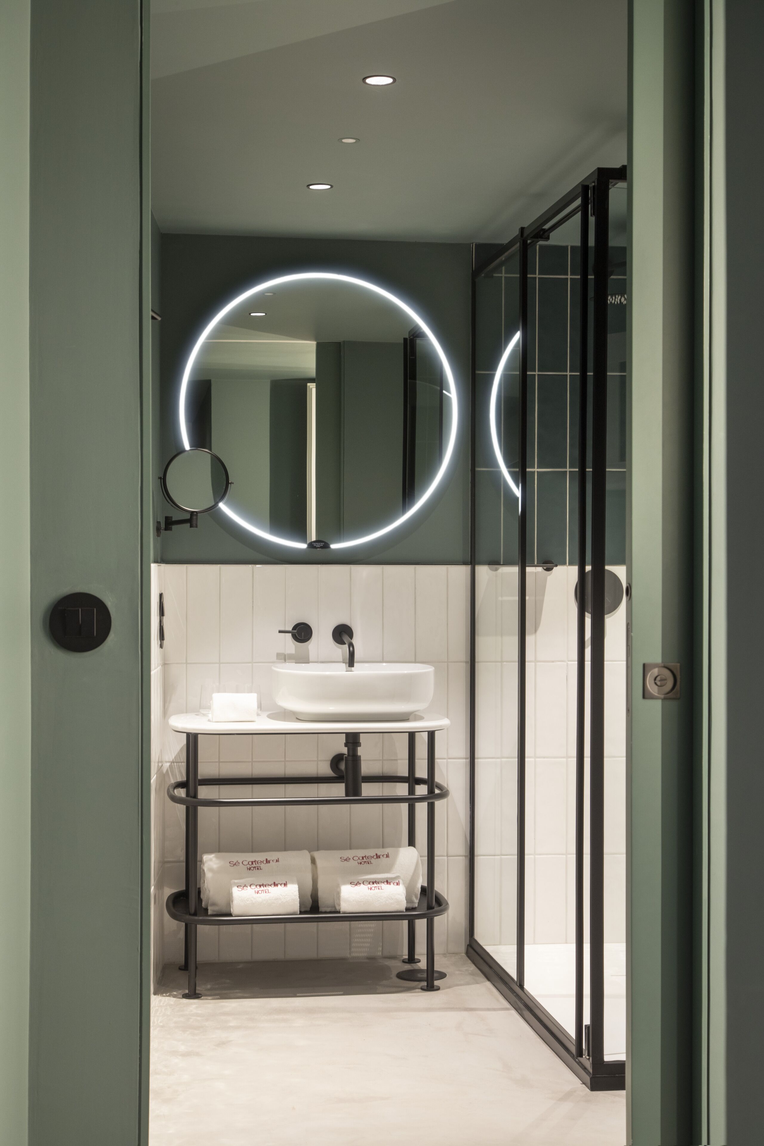 shower, hair dryer, slippers, towels