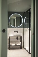 Shower, hair dryer, slippers, towels