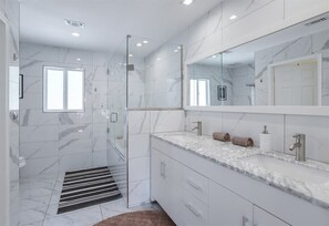 Bathtub, hair dryer, towels, soap