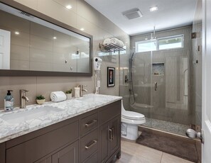 Bathtub, hair dryer, towels, soap