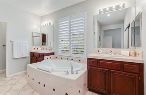 Bathtub, hair dryer, towels, soap