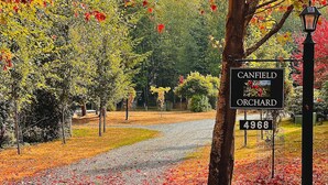 A sign for Canfield Orchard with a number 4968. - Whidbey Island Orchard House Estate Langley, WA (Langley)