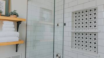 Combined shower/tub, hair dryer, towels, soap