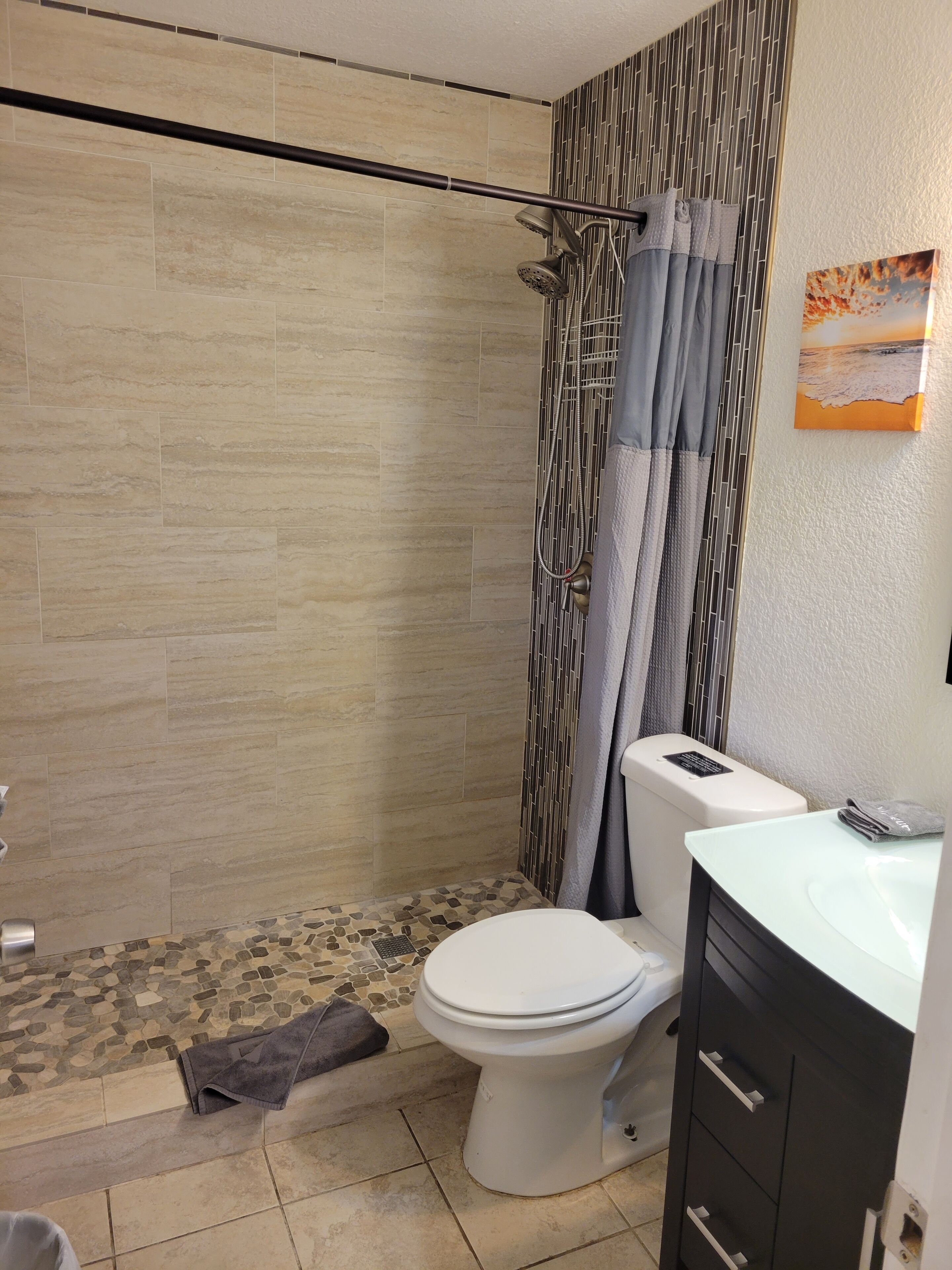 Combined shower/tub, hair dryer, towels, soap