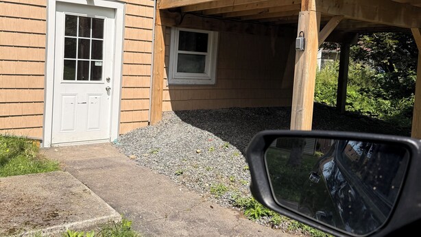 A residential building with a wooden deck, a white door, and a small window. - Short term rental (Sydney)