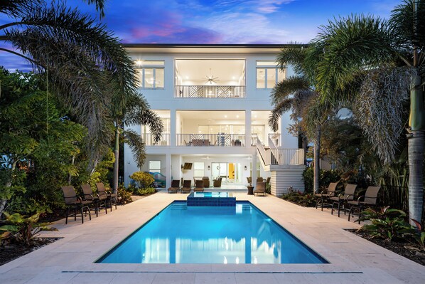 Outdoor pool, a heated pool - Bayfront Luxury Estate – 5BR, Heated Pool, Spa, Gulf Access & Walk to Beach (Bonita Springs)