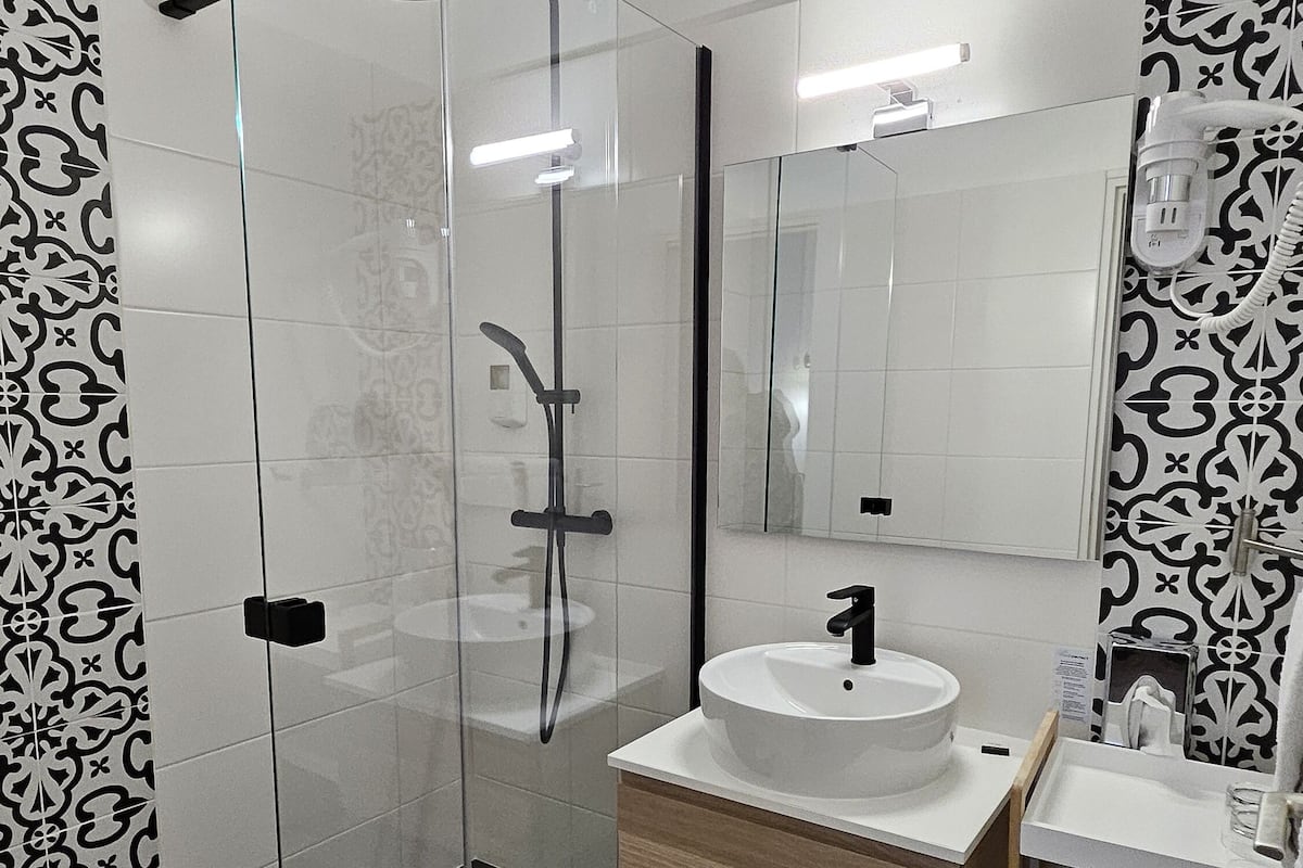 junior suite | bathroom | eco-friendly toiletries, hair dryer, towels, soap