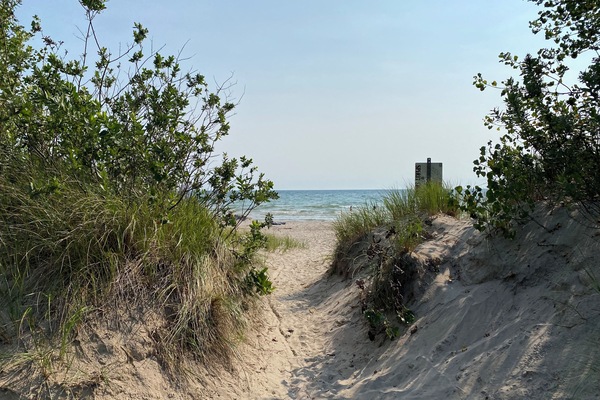 Beach across the water accessible by canoe, kayaks or boat.