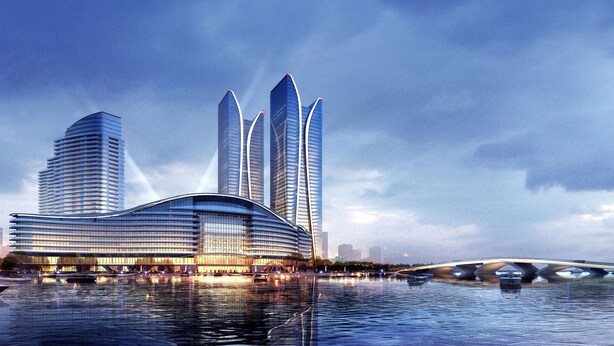 A modern hotel with a curved facade, multiple high-rise buildings in the background, and a bridge over a body of water. - Sheraton Rizhao Hotel (Rizhao)