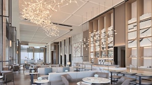 A modern hotel lobby with seating areas, a bar, and a lounge. - Jinhua Marriott Hotel (Jinhua)