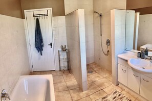 Bathtub, hair dryer, towels, soap