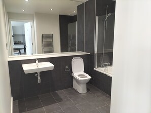 Combined shower/tub, hair dryer, towels, soap