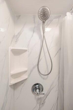 Combined shower/tub, hair dryer, towels, soap