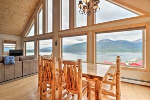 Enjoy a panoramic view of the lake and distant mountains from this room's large windows.