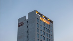 A tall hotel building with the name 'HOTEL KENNY' prominently displayed on the facade. - KENNY STAY BUSAN GIJIANG - HOTEL KENNY (Busan)