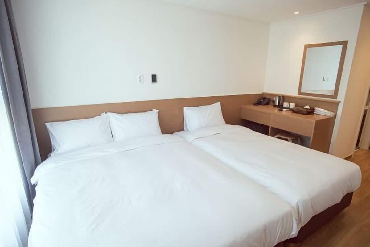 Laptop workspace, free WiFi, bed sheets