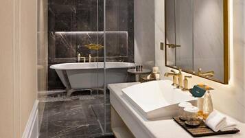 A modern bathroom with a freestanding bathtub, a double sink vanity, and a large mirror.