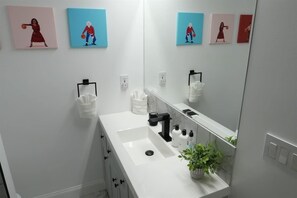 Bathtub, hair dryer, shampoo