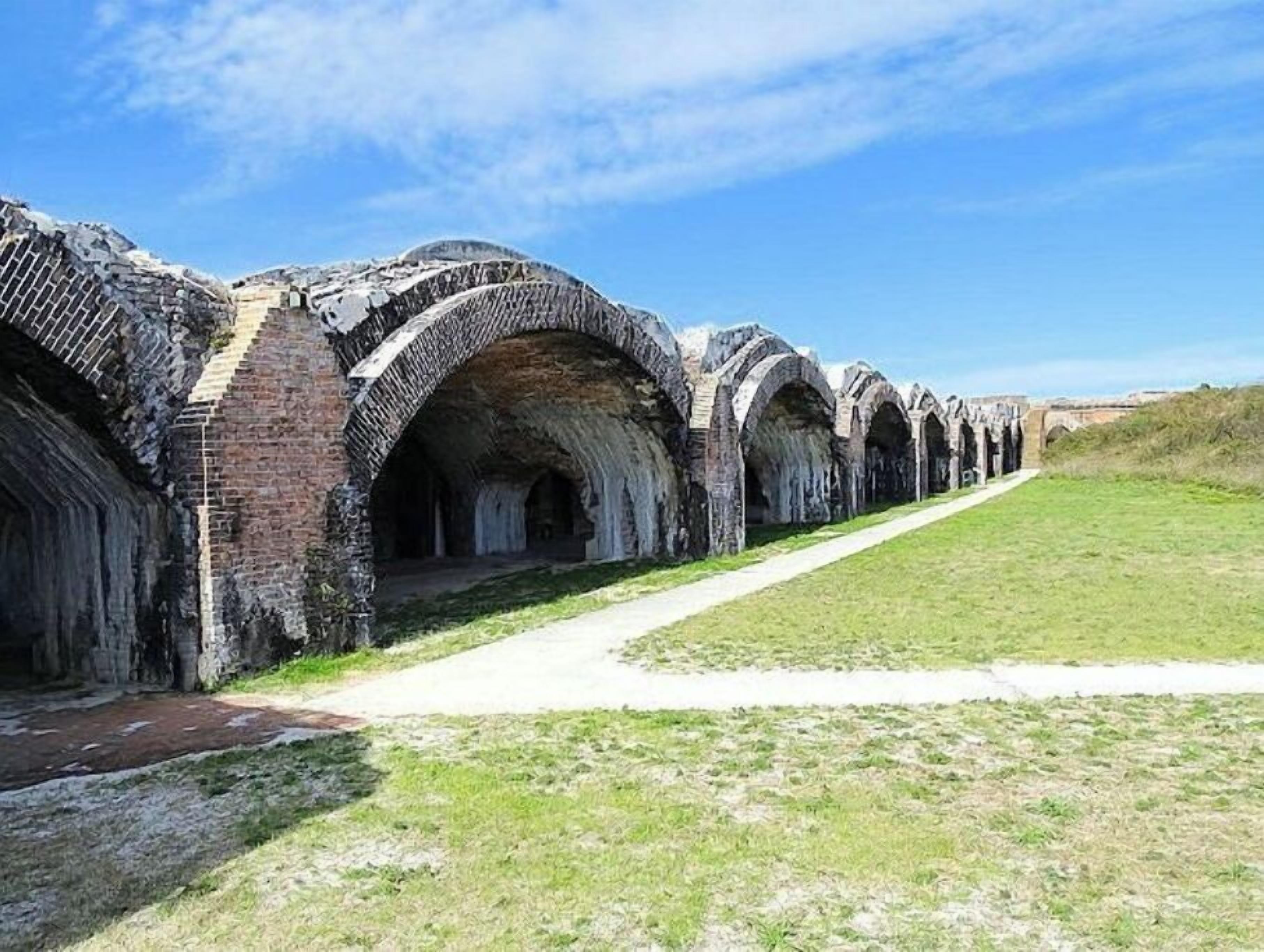 A series of stone arches forming a pathway.