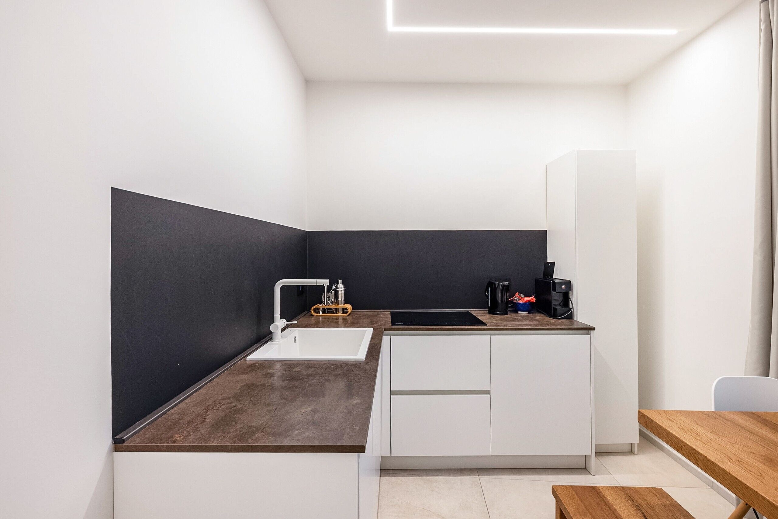 Fridge, stovetop, dishwasher, coffee/tea maker