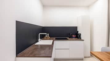 Fridge, stovetop, dishwasher, coffee/tea maker