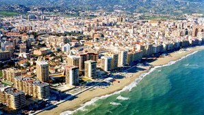 A coastal cityscape with high-rise buildings, a beach, and a clear view of the ocean. - Villa 'El Coto' close to Fuengirola  (Mijas Costa)