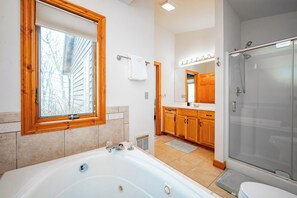 Shower, jetted bath, towels