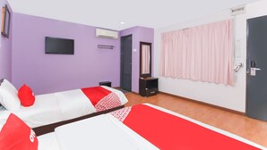 A hotel room with two beds, a TV, an air conditioning unit, a mirror, and a door with a phone. - OYO 90345 TM Hotel (Taman Melawati)
