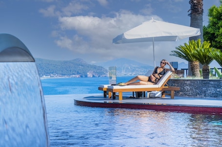 Indoor pool, outdoor pool, pool umbrellas, sun loungers