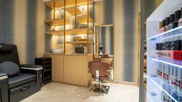 A modern bathroom with a vanity, shelves, and a mirror.