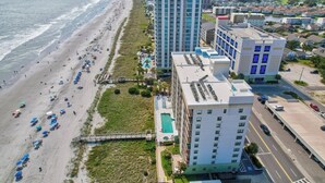 A coastal hotel with a pool, beach access, and a view of the ocean. - Oceanfront 3BR/2B  Springs Towers 704  Pool, Hot Tub, Fitness Room (North Myrtle Beach)