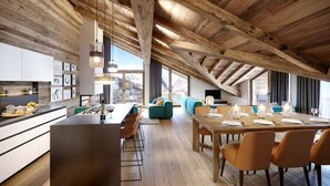 Spazioso loft con soffitto alto, travi in legno a vista, cucina dotata di elettrodomestici moderni, zona pranzo con sedie arancioni e un'ampia finestra con vista sulle montagne.