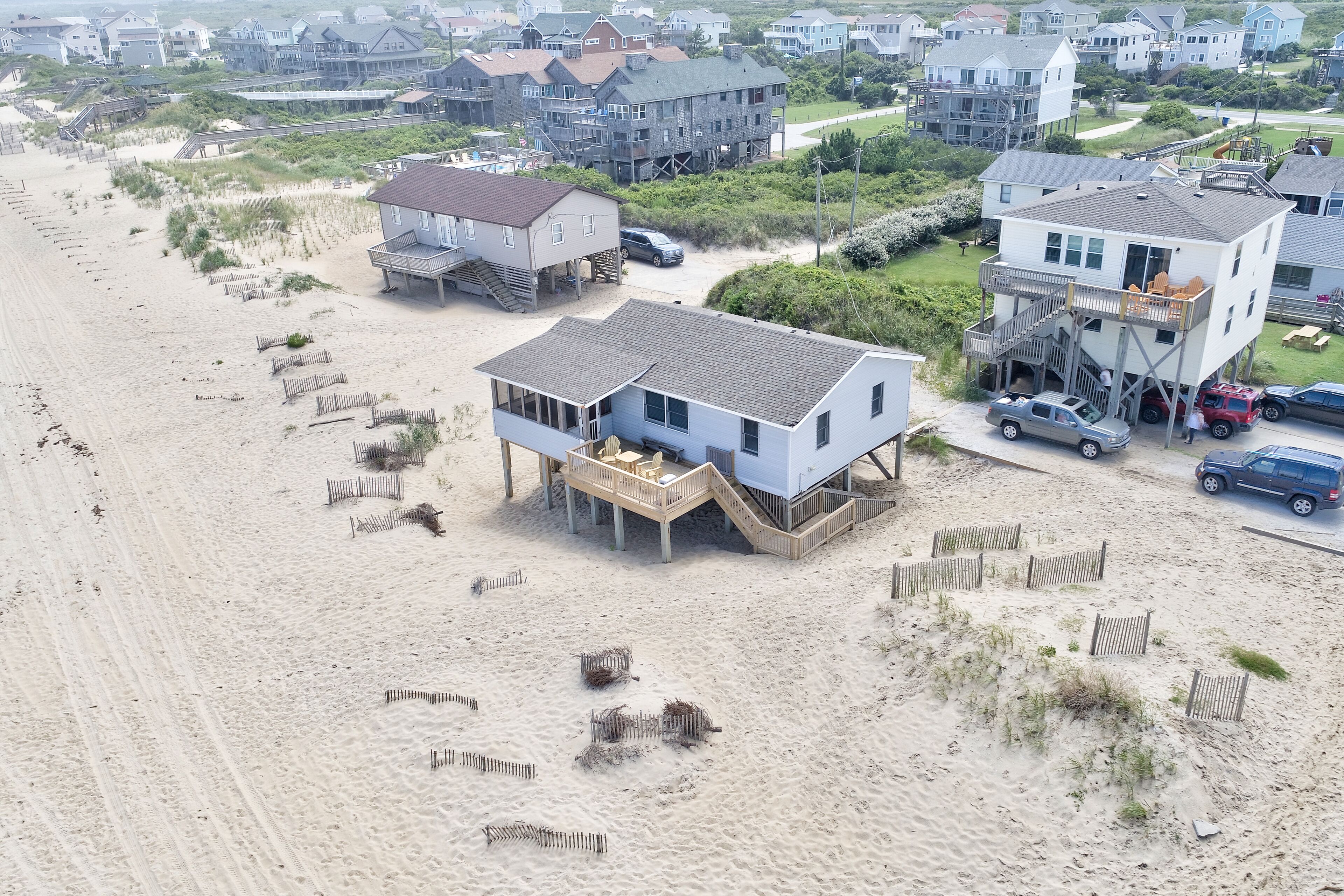 Dog-friendly beachfront house with deck, W/D, community pool, & central AC